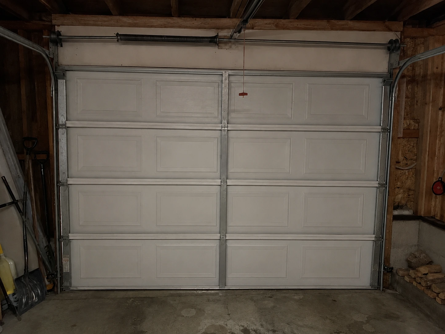 New garage door lift cable installed by Boost Garage Doors on an Olympia, WA door.