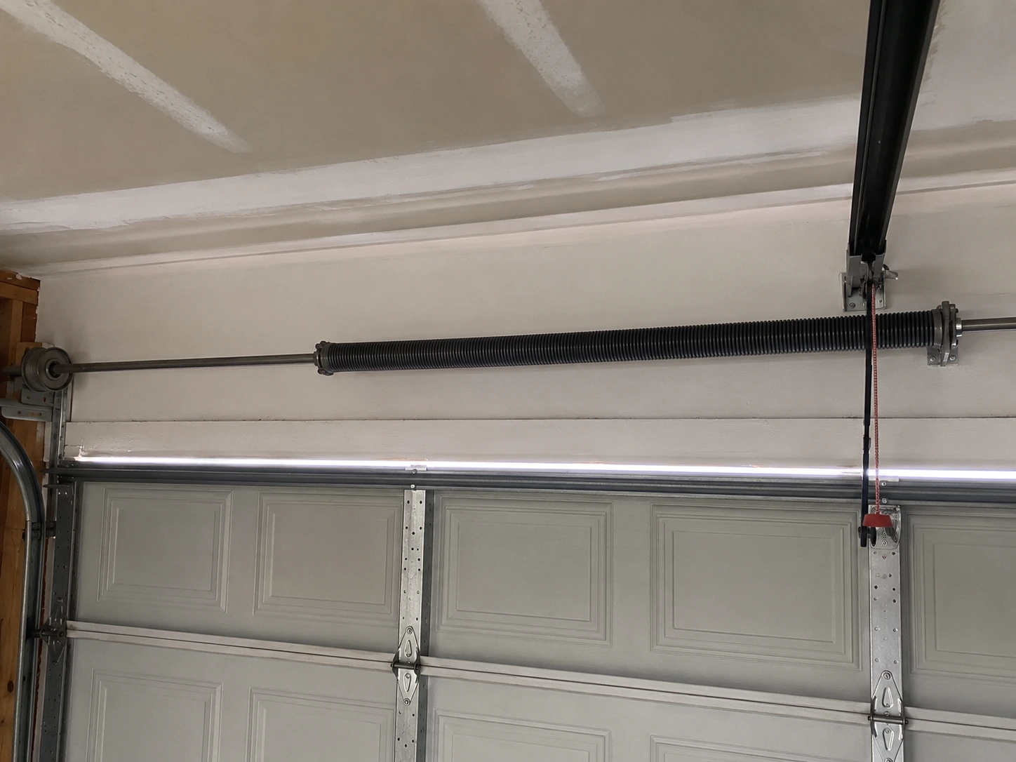 New torsion spring installed by Boost Garage Doors on a Bremerton, WA garage door.