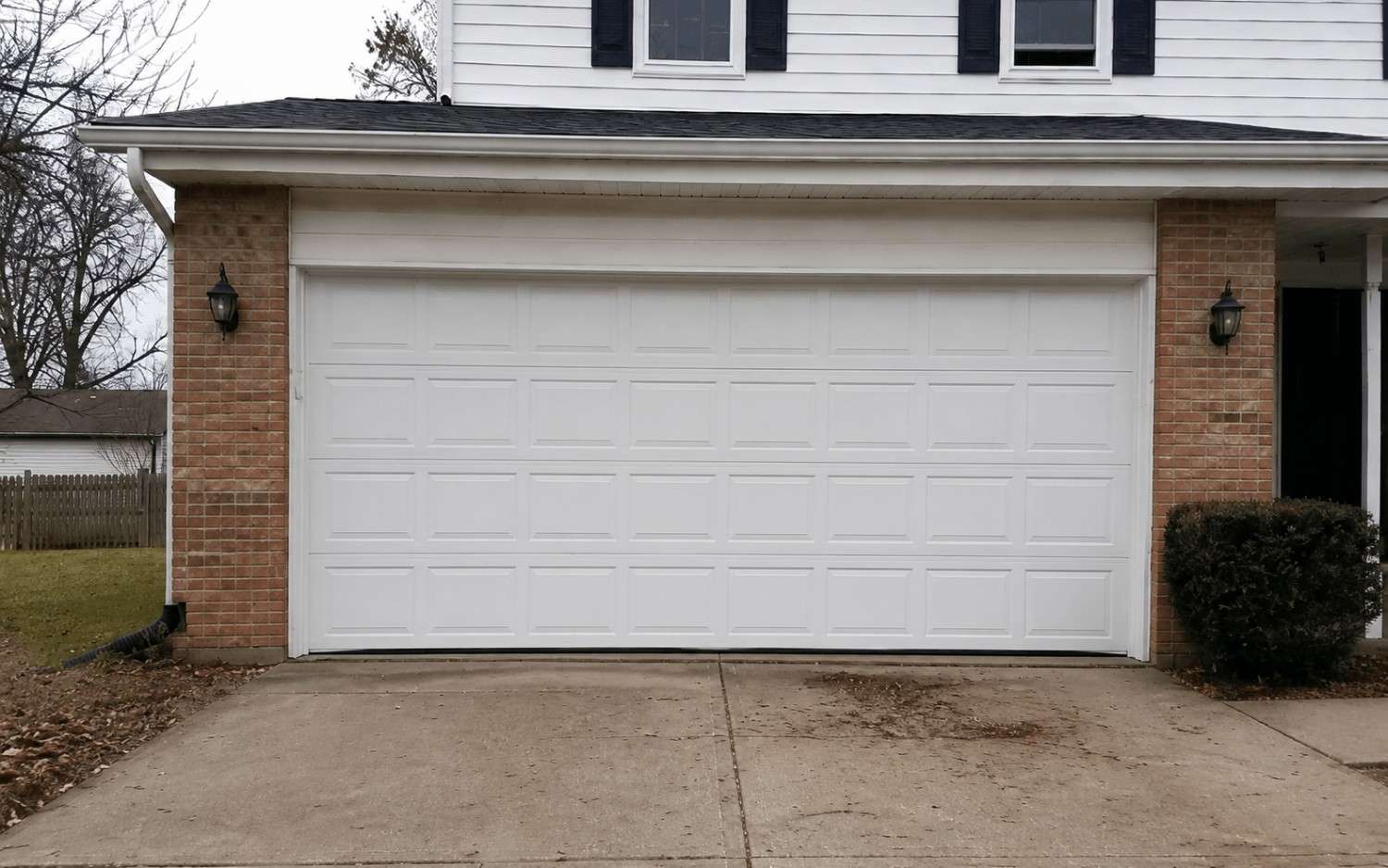 Garage door track realigned and running true after off track repair.